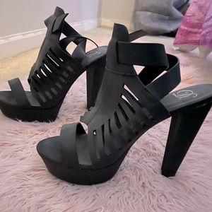High heeled ankle strap secure black sexy heels . Perfect condition. Never warn